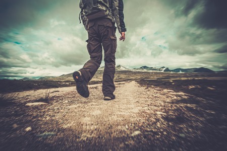 Hiker walking in a valley