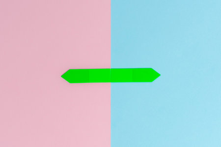 Comparison of two objects blocks pencils sticker notes facing inward outward making an arrangement reflection on a separated coloured background shot in a flat lay perspective
