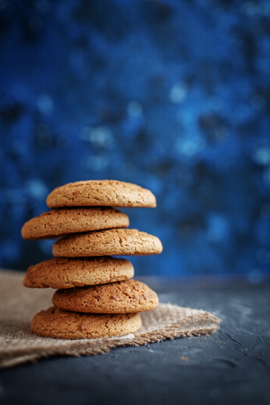 Oatmeal cookies on sacking background the concept of healthy eating and vegetarianism