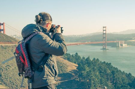 Man photographing san francisco cityscape from twin peaks Stock Photo