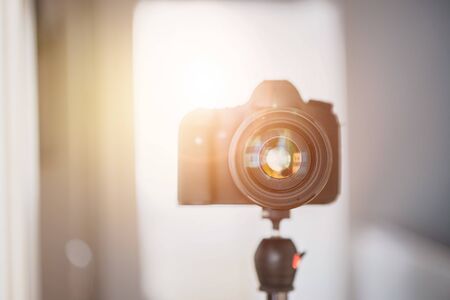 Close up of professional photo camera on a tripod lens Stock Photo