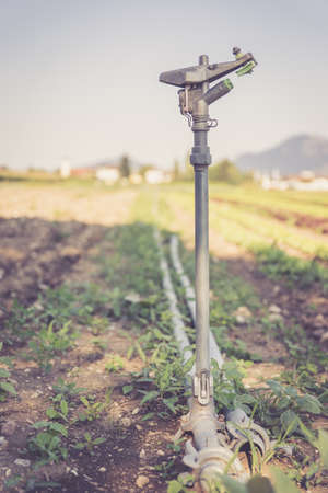 Irrigation plant on an agriculture field summer day soil Stok Fotoğraf