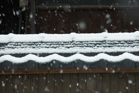 Snow and tile Фото со стока