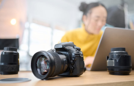 Photography camera laptop and photographer editing photoshoot focus on digital art or retouching artistic photo studio creative vision and professional asian woman working on creativity process