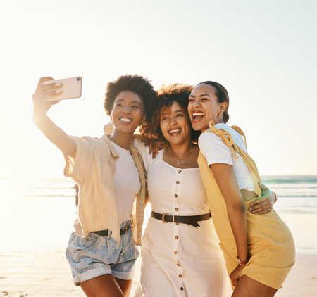 Happy selfie and women with friends at beach for support social media and diversity smile relax and profile picture with group of people in nature for community peace and summer vacation Foto de archivo