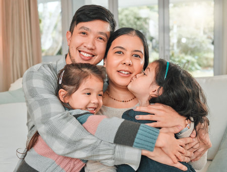 Family kiss and portrait in home for hug love and support or care for children in apartment happy woman and man or kids in living room for weekend smile and together on couch for relax in mexico