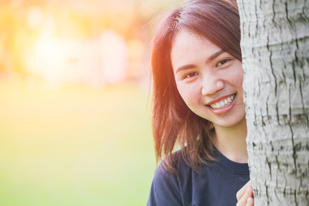 Asian healthy cute teen smile in the park space for text