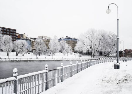 River in the middle of the city on a cold and cloudy winter day