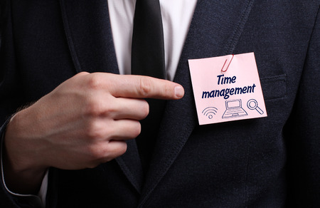 Business technology internet and network concept young businessman shows the word time management Stock Photo