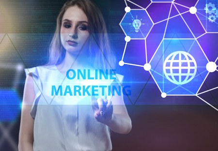 The concept of business technology the internet and the network a young entrepreneur working on a virtual screen of the future and sees the inscription online marketing Stock Photo