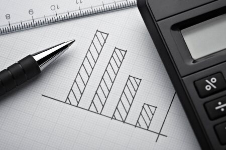 Close up of a business finance graph papers and pencil Stock Photo