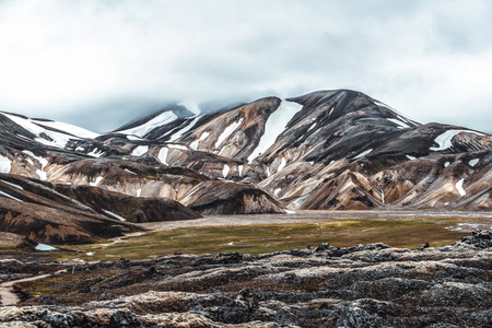 Landscape of landmannalaugar surreal nature scenery in highland of iceland nordic europe beautiful colorful snow mountain terrain famous for summer trekking adventure and outdoor walking