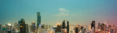 Night cityscape and high rise buildings in metropolis city center downtown business district in panoramic view Stock Photo