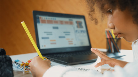 African girl writing car model structure while laptop display code smart student working by using laptop develop program or learning programing engineering prompt erudition in stem class work