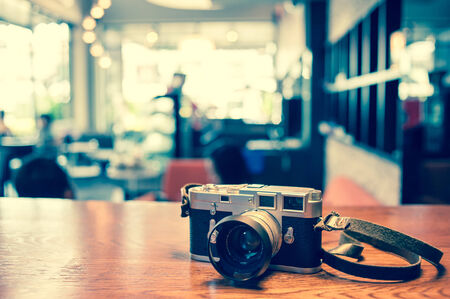 Classic camera in coffee shop vintage color Stock Photo