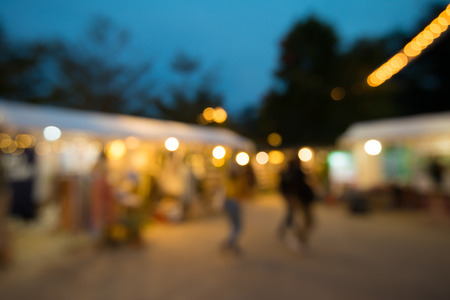 Abstract blur people in garden village night festival bokeh background vintage festival outdoor market fair Stock Photo