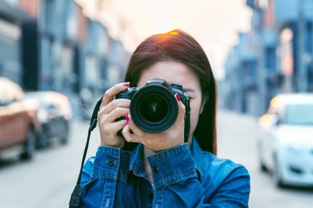 Photographer taking pictures with digital camera vintage tone Stock Photo