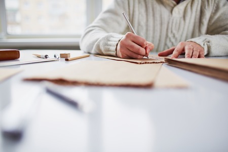 Image of male hands drawing pictures