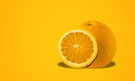 Fresh orange on orange background fruit concept