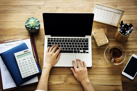 Woman working plan on a wooden table