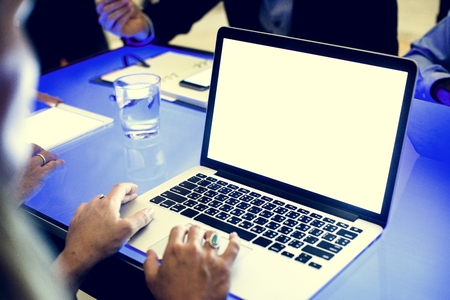 Hands on laptop working in a technology meeting Stock Photo