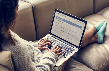 Woman working on a laptop Stock Photo