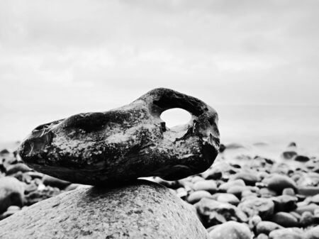 Balance of pebbles against the background of blurred sea smooth atmosphere on hotel beach