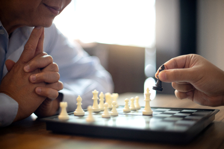 Image of hands confident businessman playing chess game to development analysis new strategy plan leader and teamwork concept for success