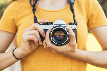 Close up of a photographer with her camera photographer concept Stock Photo