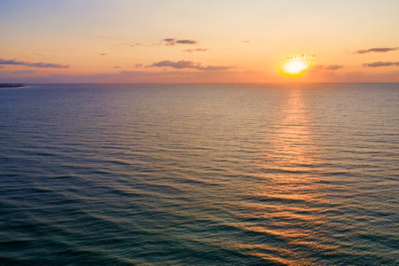 Aerial landscape at sunrise sun reflecting in the water summer resort view