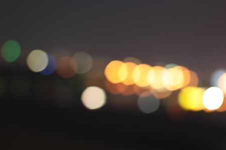 Blurred bokeh of car in city at night Stock Photo