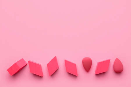 Makeup sponges on color background Stock Photo