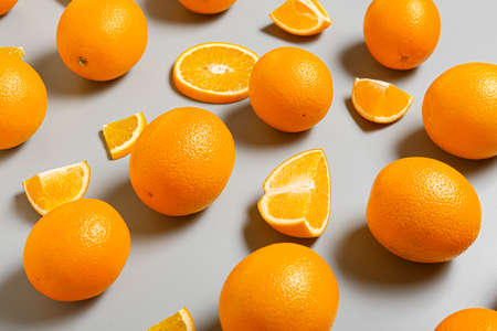 Fresh oranges on light background