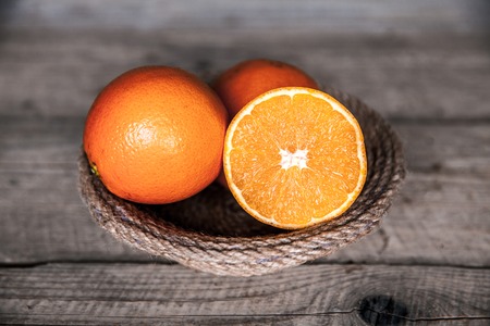 Fresh orange on a wooden background