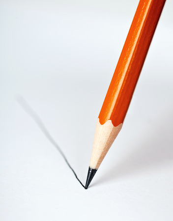Pencil draws a straight line on a white background