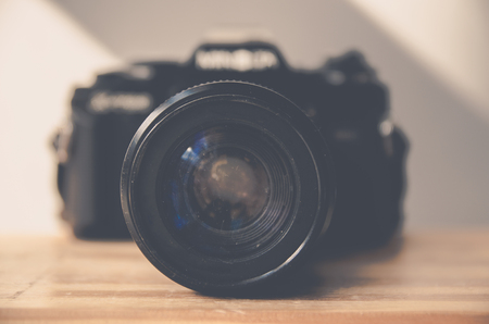 Retro camera on wooden table camera vintage