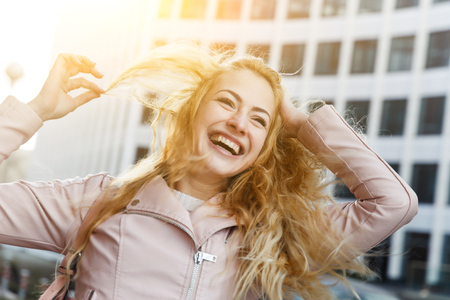 Woman with long hair laughing