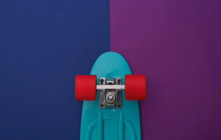 Cruiser board on a classic blue purple background youth entertainment top view