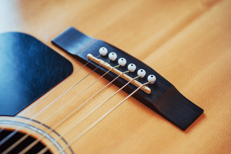 Detail of classic guitar with shallow depth of field