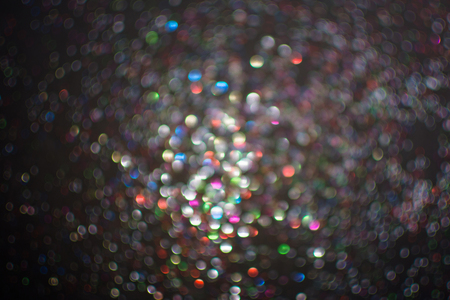 Blur of glitter on black background