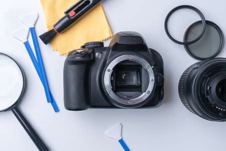 Tools for cleaning the matrix and lens of a dslr camera on a white background