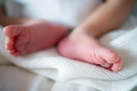 Close up new born infant baby feet