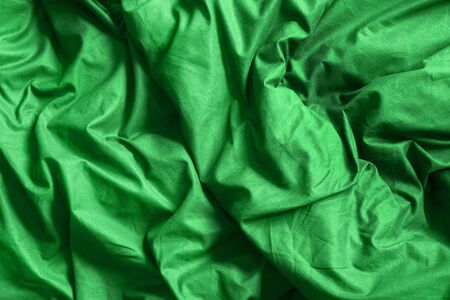 Crumpled green material as a background