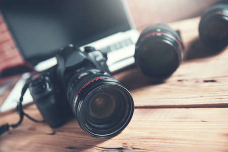 Camera with lens and computer Stock Photo