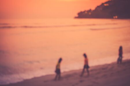 Blur kids playing on tropical sunset beach travel concept retro color style