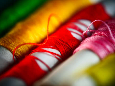 Sewing threads multicolored background closeup selective focus macro Stock Photo