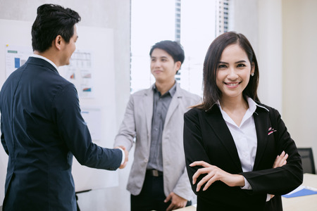 Asian business women and group using notebook for meeting and business women smiling happy for working