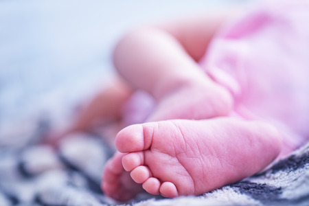 Feet baby baby foot the feet of a little girl Фото со стока