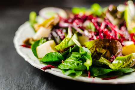 Closeup of healthy salad in plate on table Stock Photo