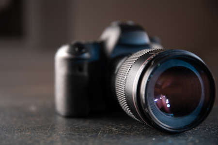 Professional digital camera close up on a blurred background the concept of technology for working with photos and videos